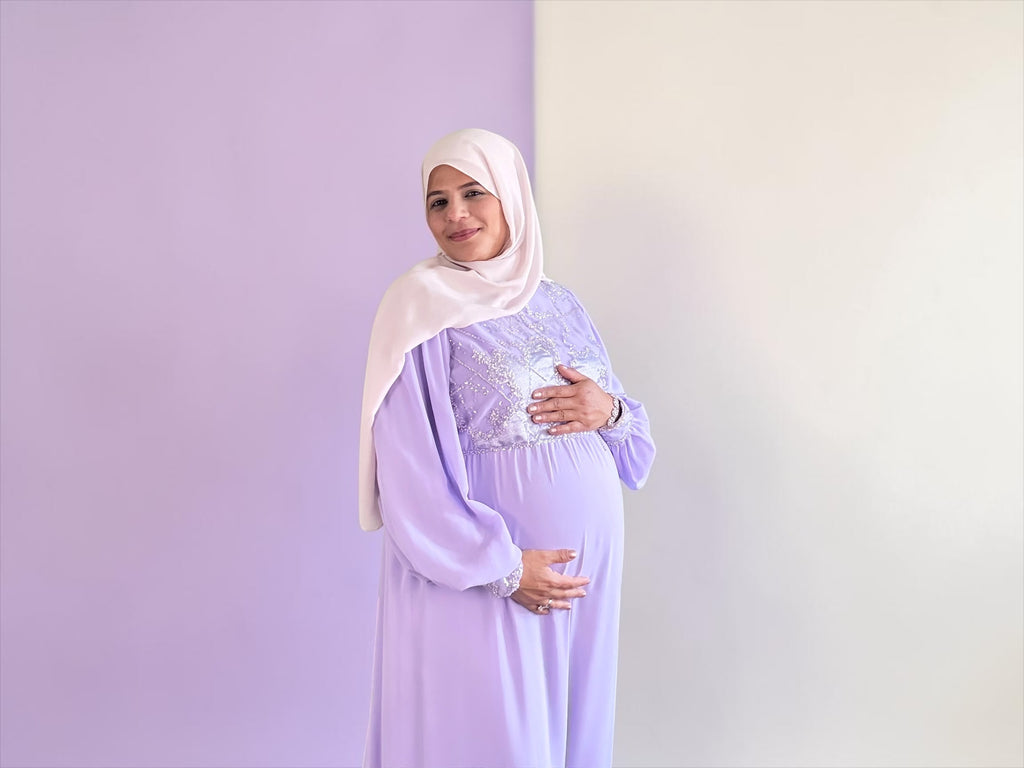 Lavender embellished maxi dress styled over a baby bump