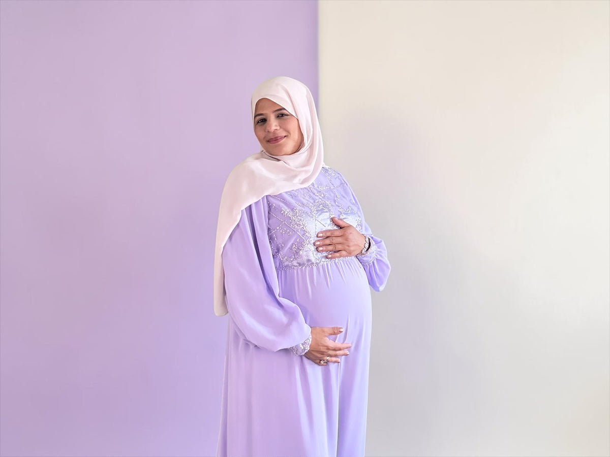 Lavender embellished maxi dress styled over a baby bump