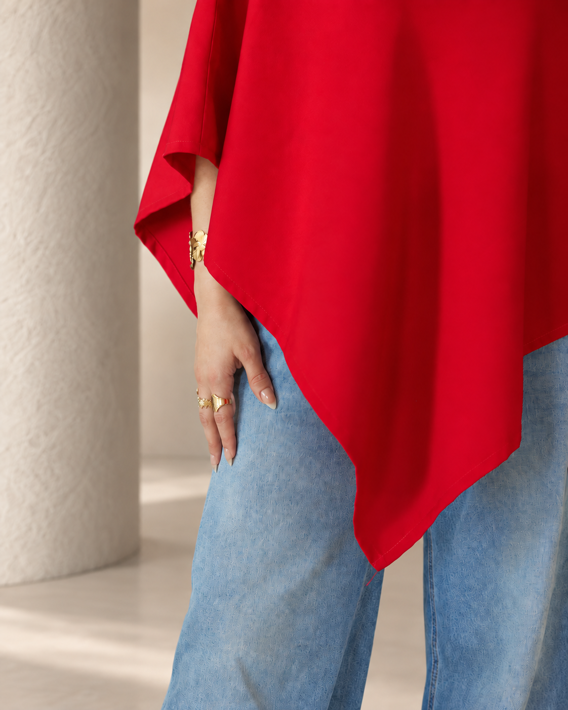 Asymmetric hem detail on nursing poncho tunic